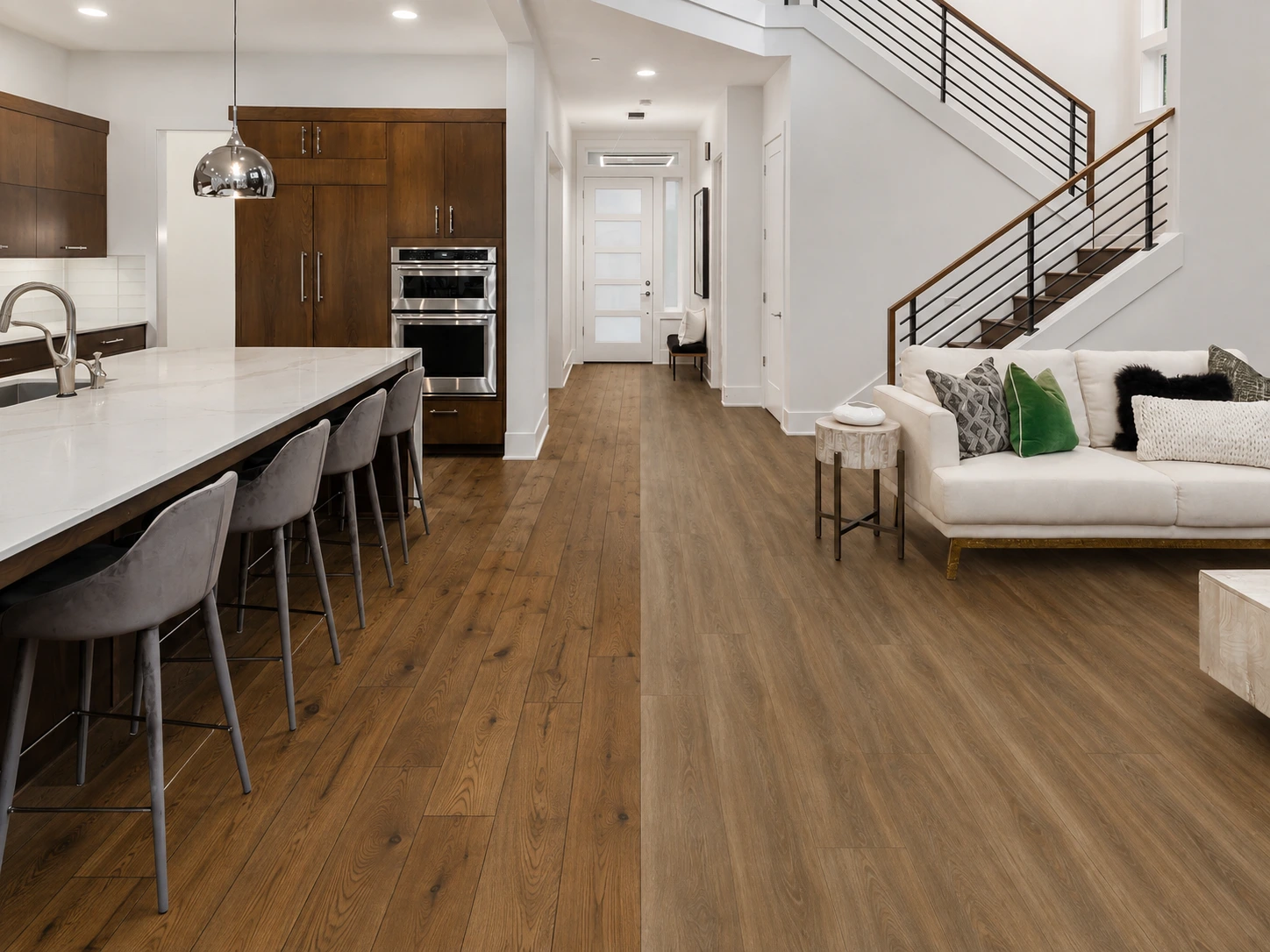 Coordinated transition between natural hardwood and complementary luxury vinyl plank at a doorway